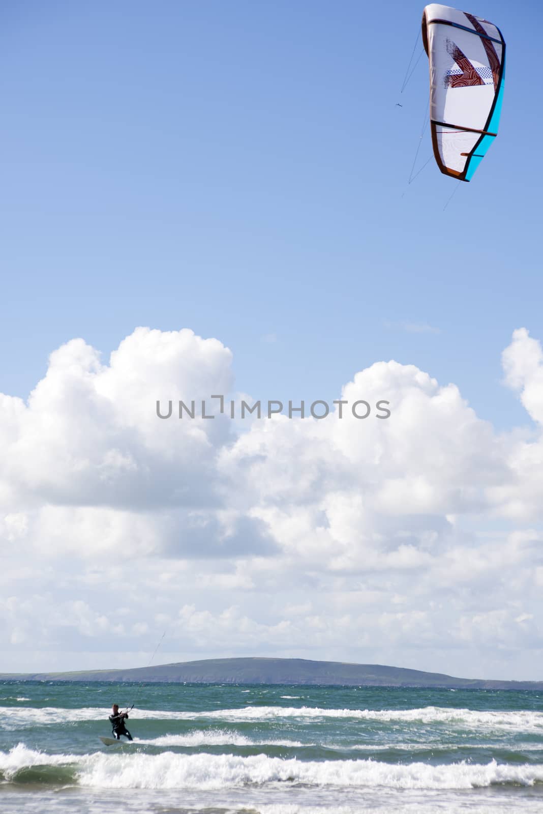 extreme kite surfer on fast surf by morrbyte