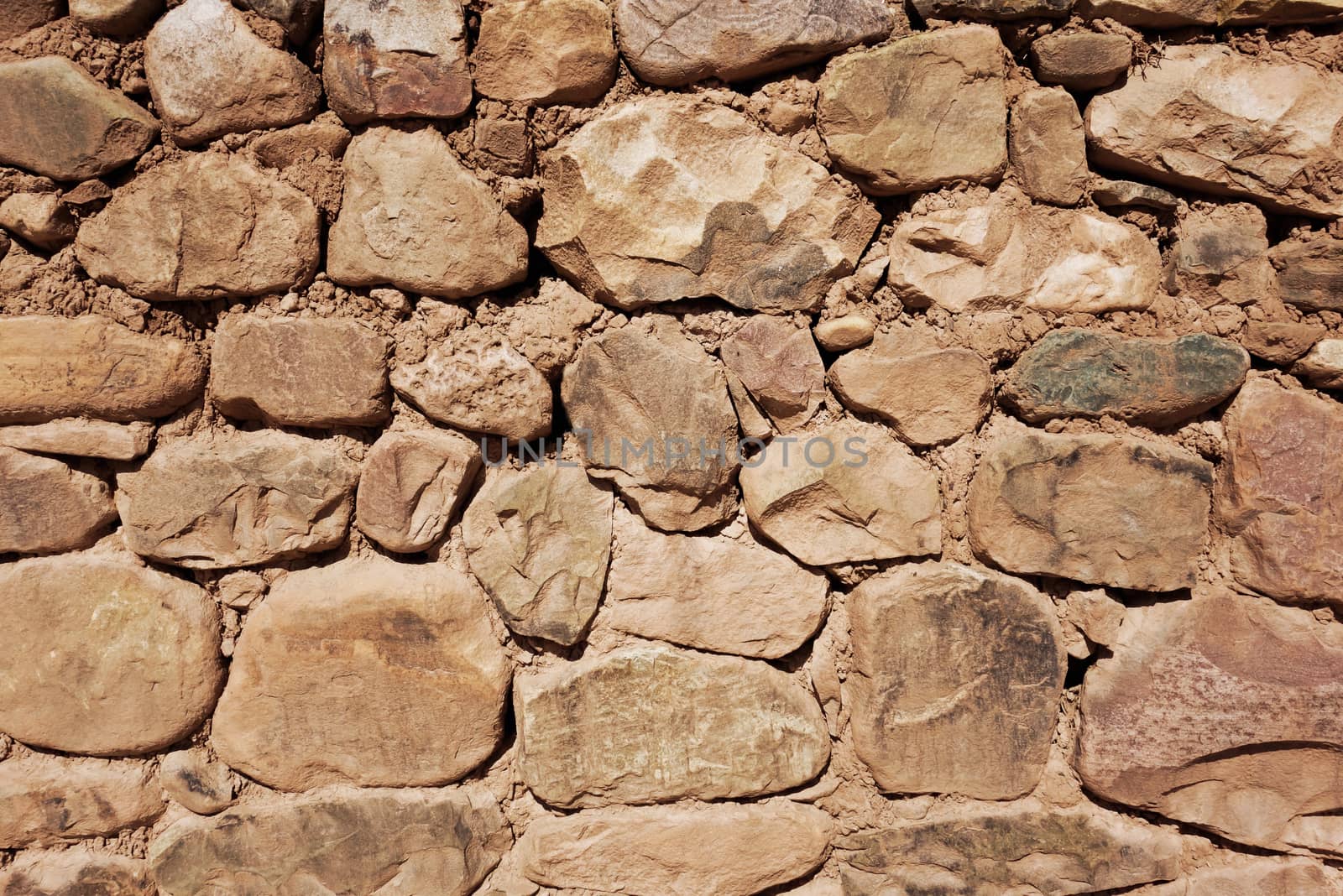 Old rough stone wall, background wallpaper                               