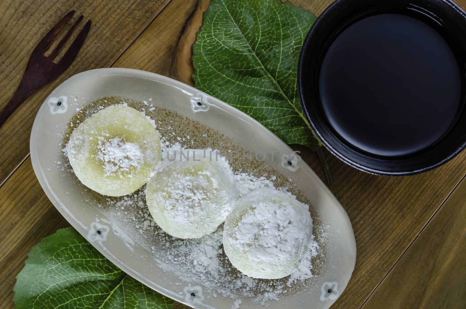 Daifuku Mochi Japanese dessert on dish over wooden background