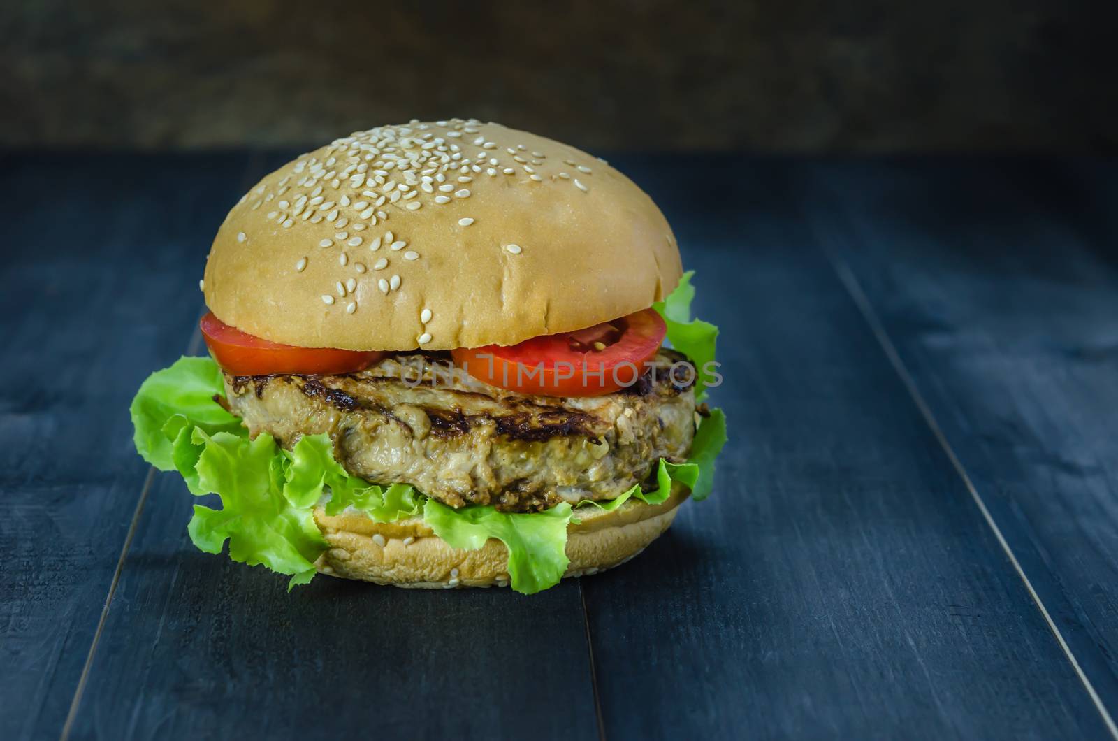 Closeup of home made burgers on wooden background