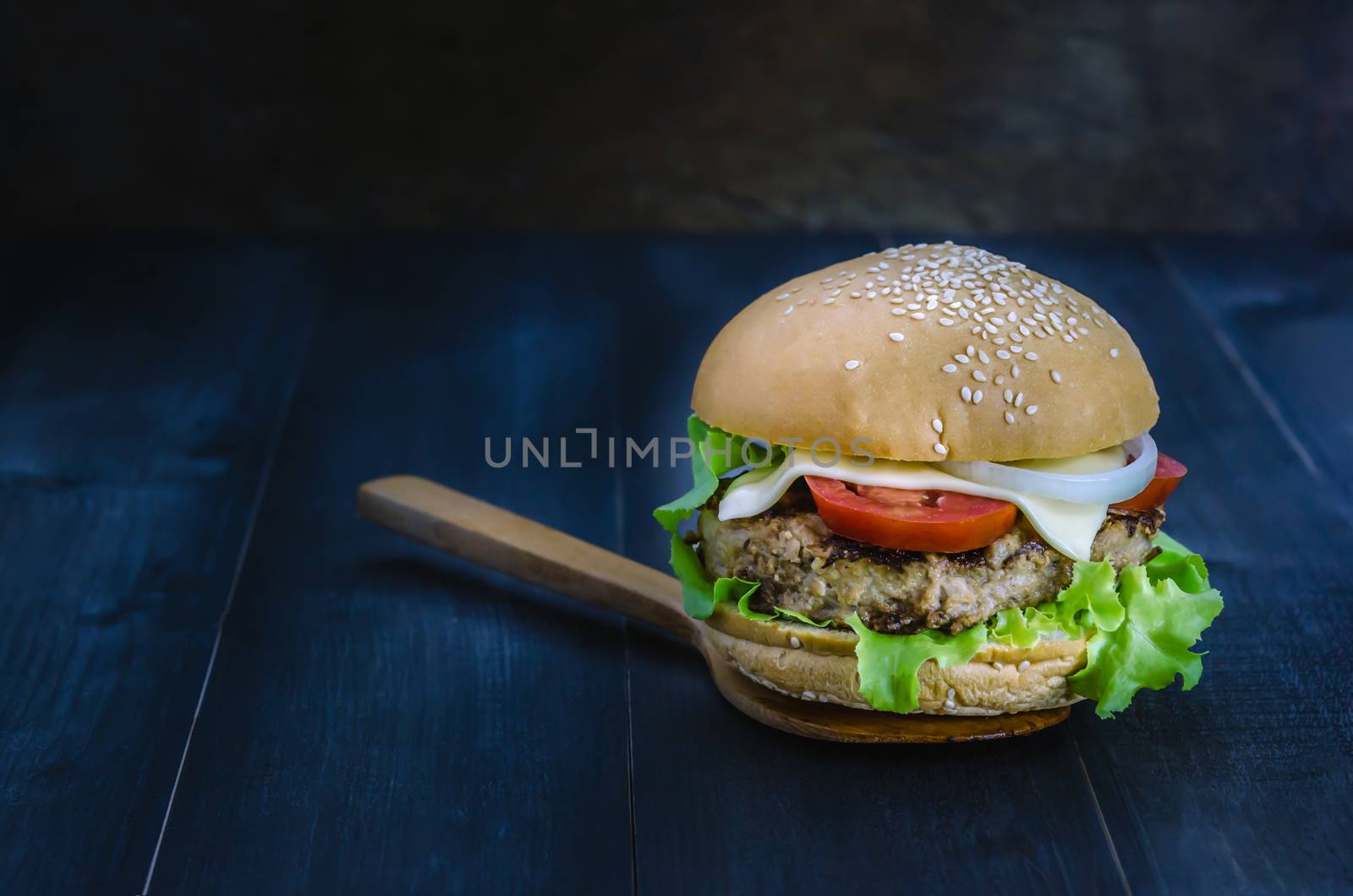 Closeup of home made burgers on wooden background