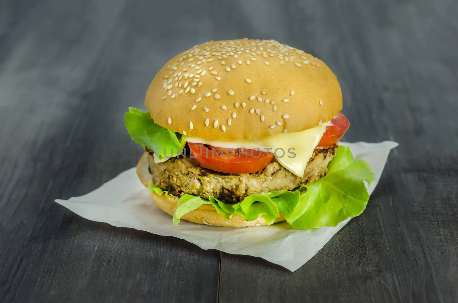 Closeup of home made burgers on wooden background