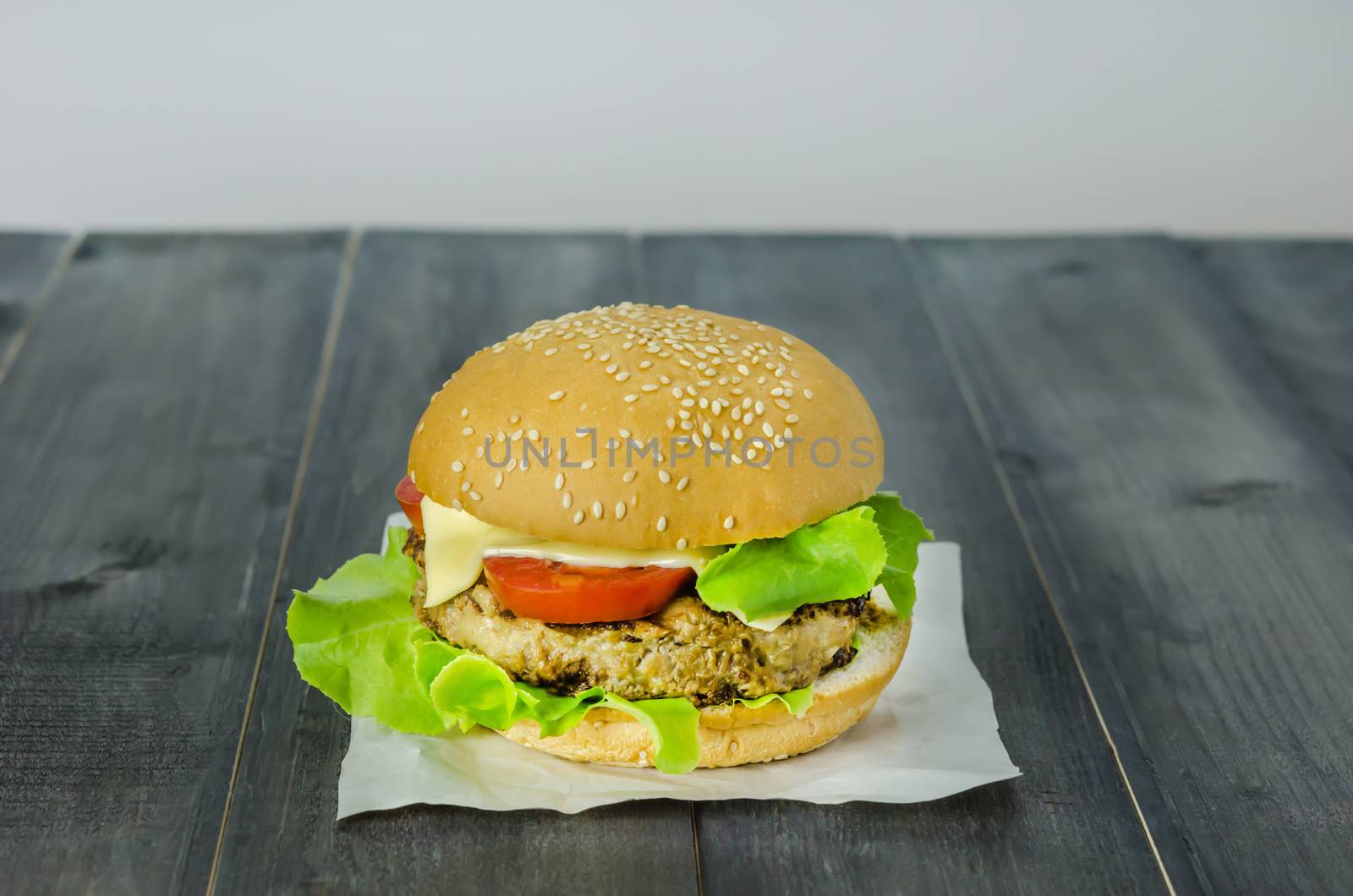 Closeup of home made burgers on wooden background
