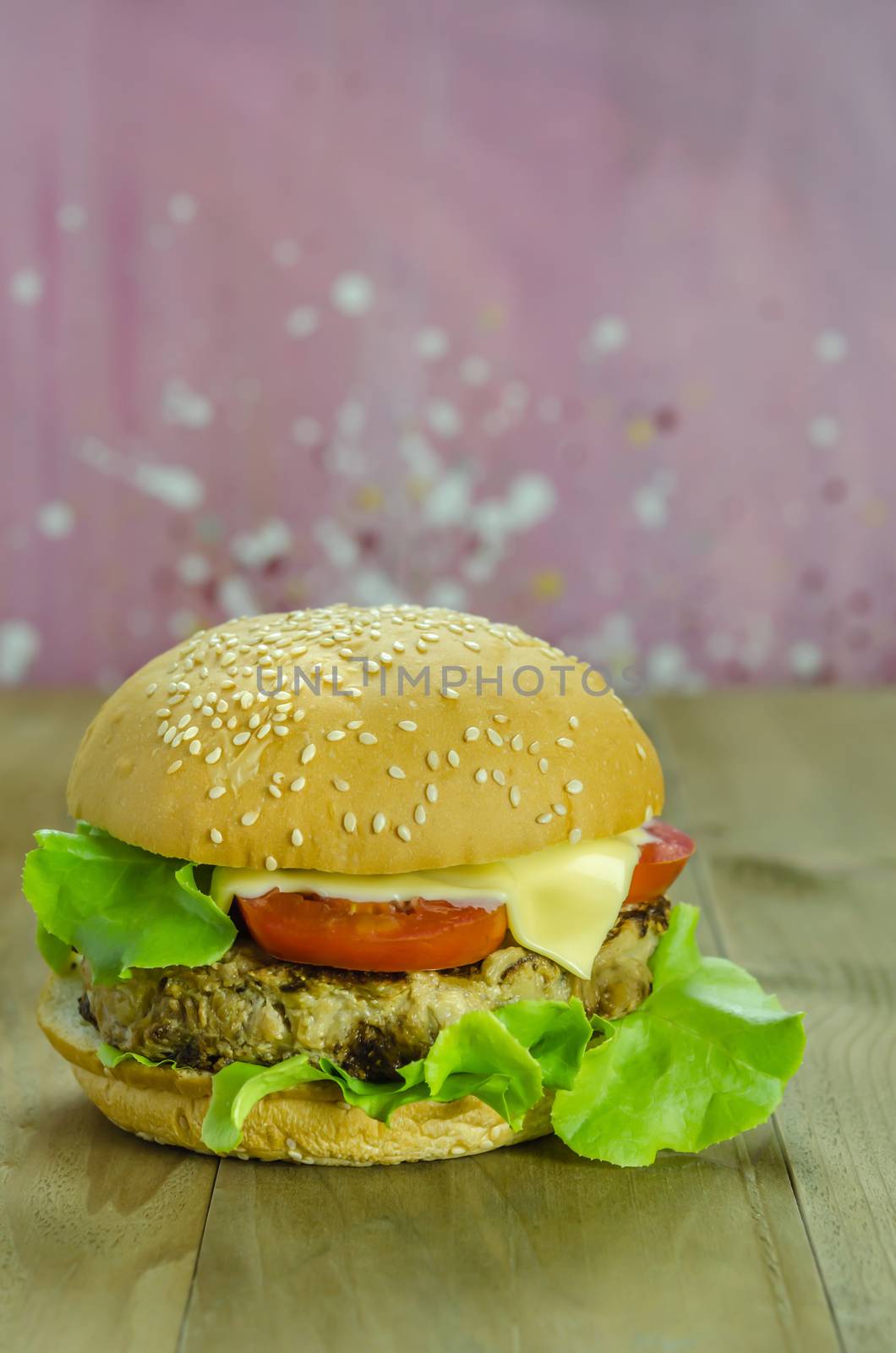 Closeup of home made burgers on wooden background