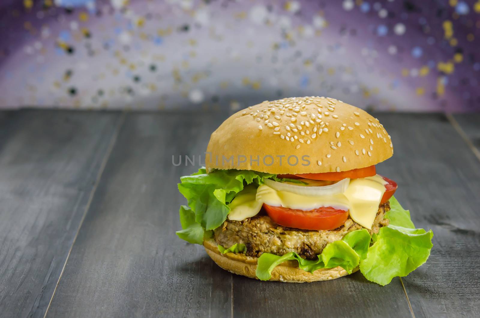 Closeup of home made burgers on wooden background