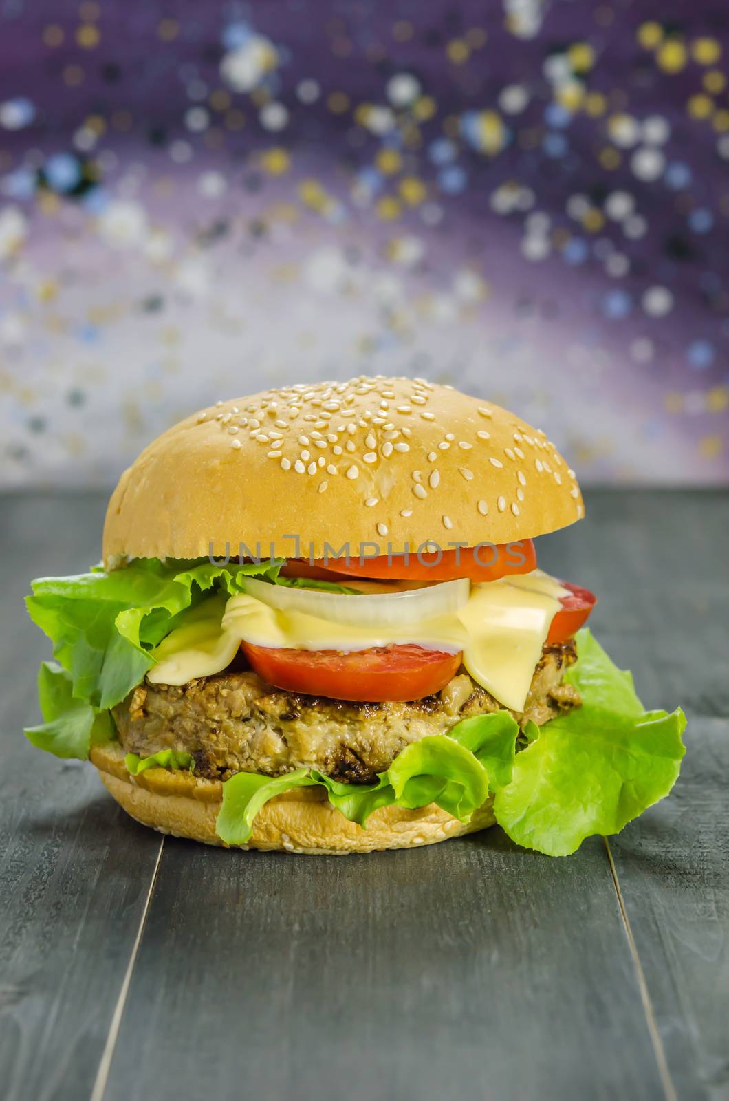 Closeup of home made burgers on wooden background