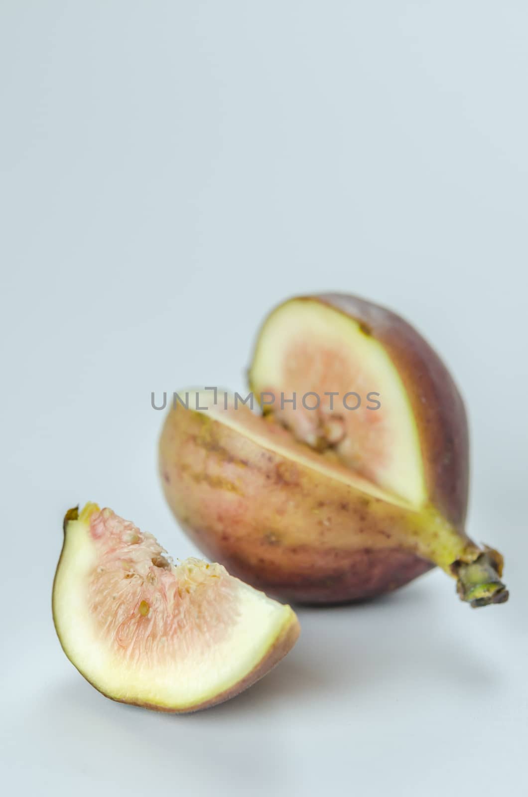 sliced fresh figs fruit on white background