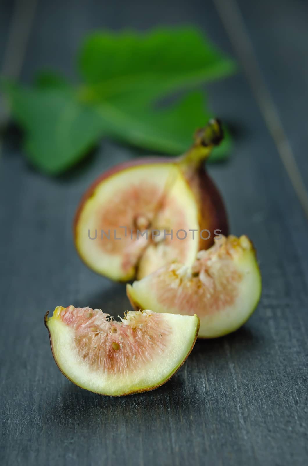 Portion of fresh Figs on wooden background