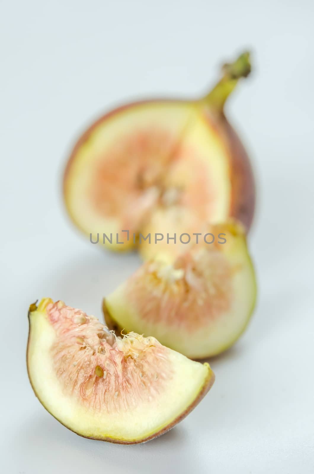 sliced fresh figs fruit on white background