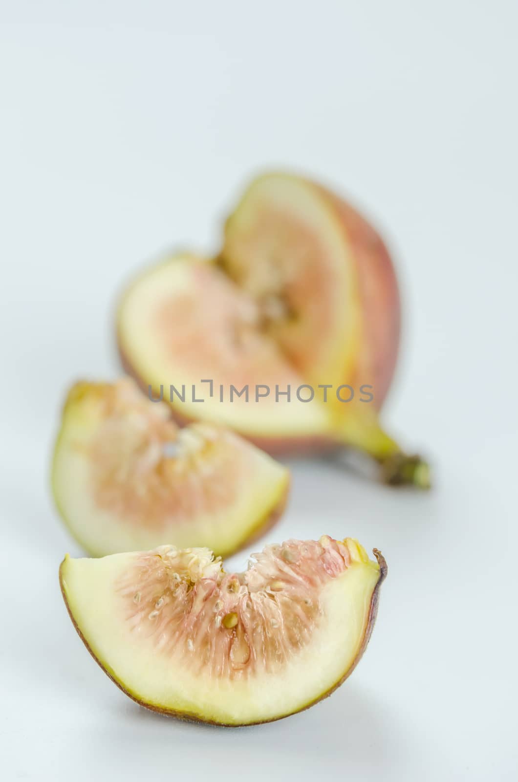sliced fresh figs fruit on white background