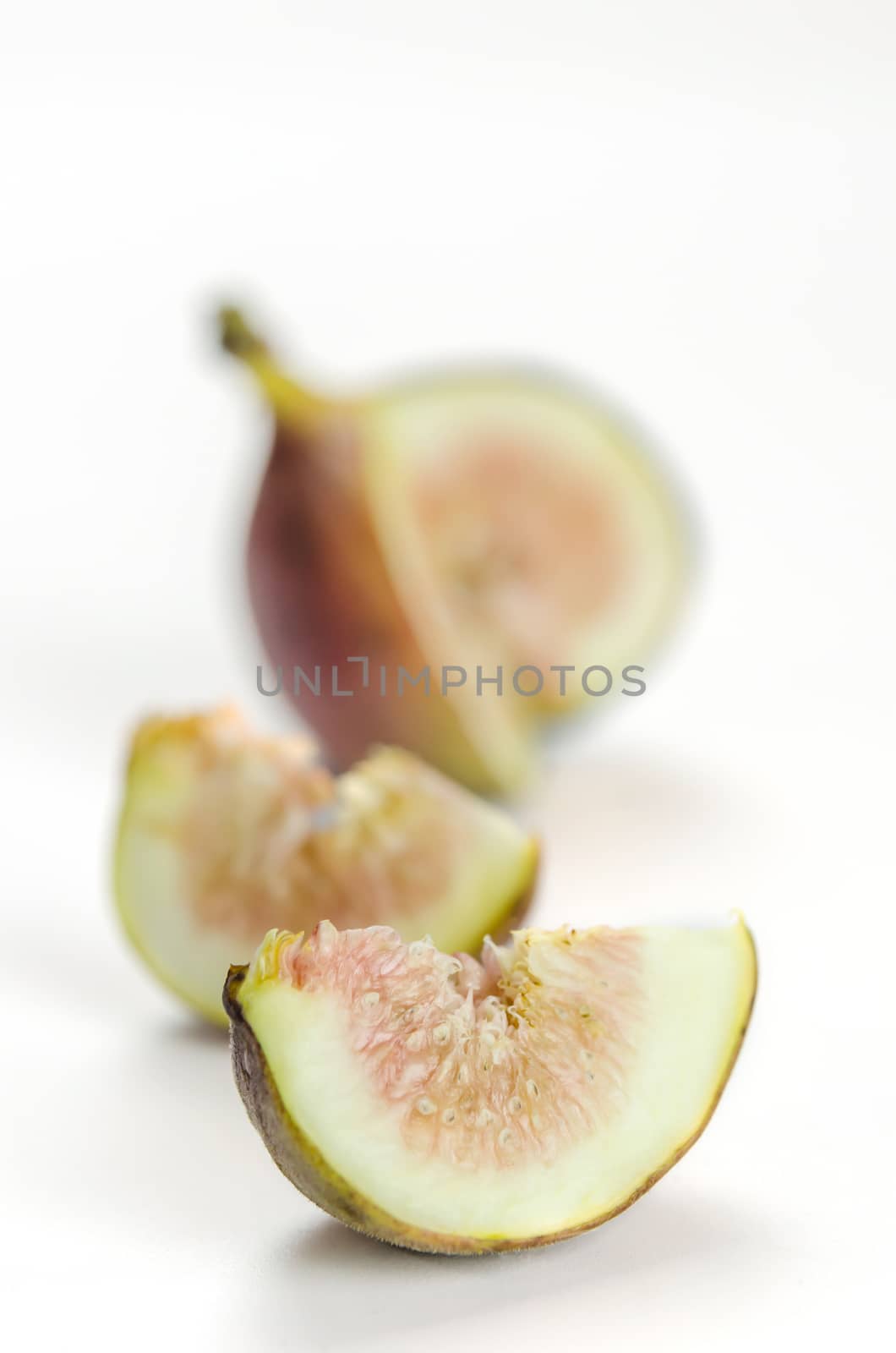 sliced fresh figs fruit on white background