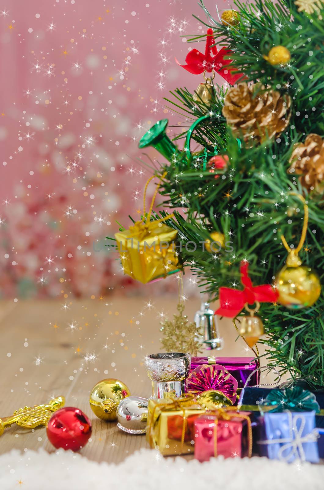 Christmas background with decorations and gift boxes on wooden board
