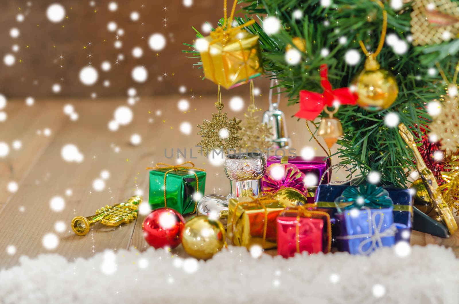 Christmas background with decorations and gift boxes on wooden board