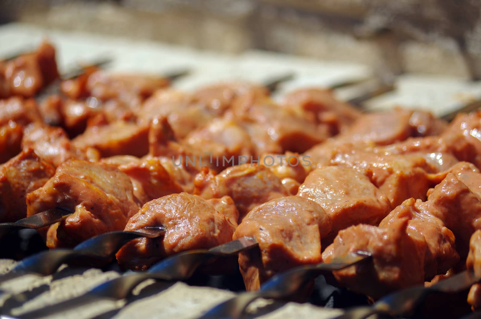 Shashlik on skewers closeup, raw and cooked by evolutionnow