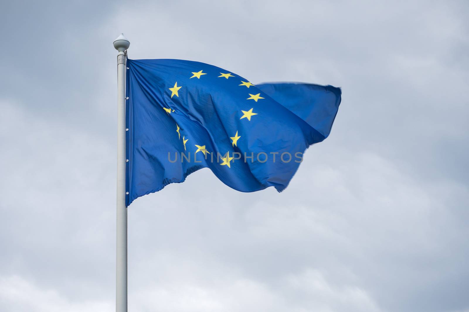The flag of the European Union fluttering on wind. by dymov