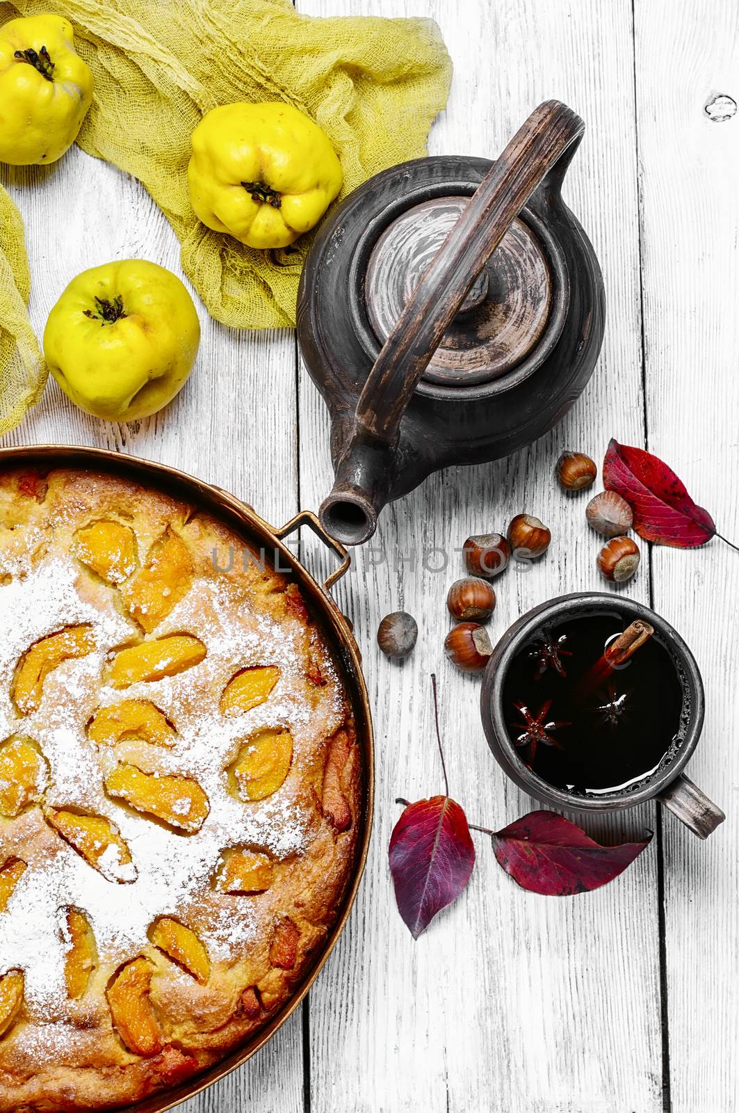 Warm aromatic tea with pie autumn quince