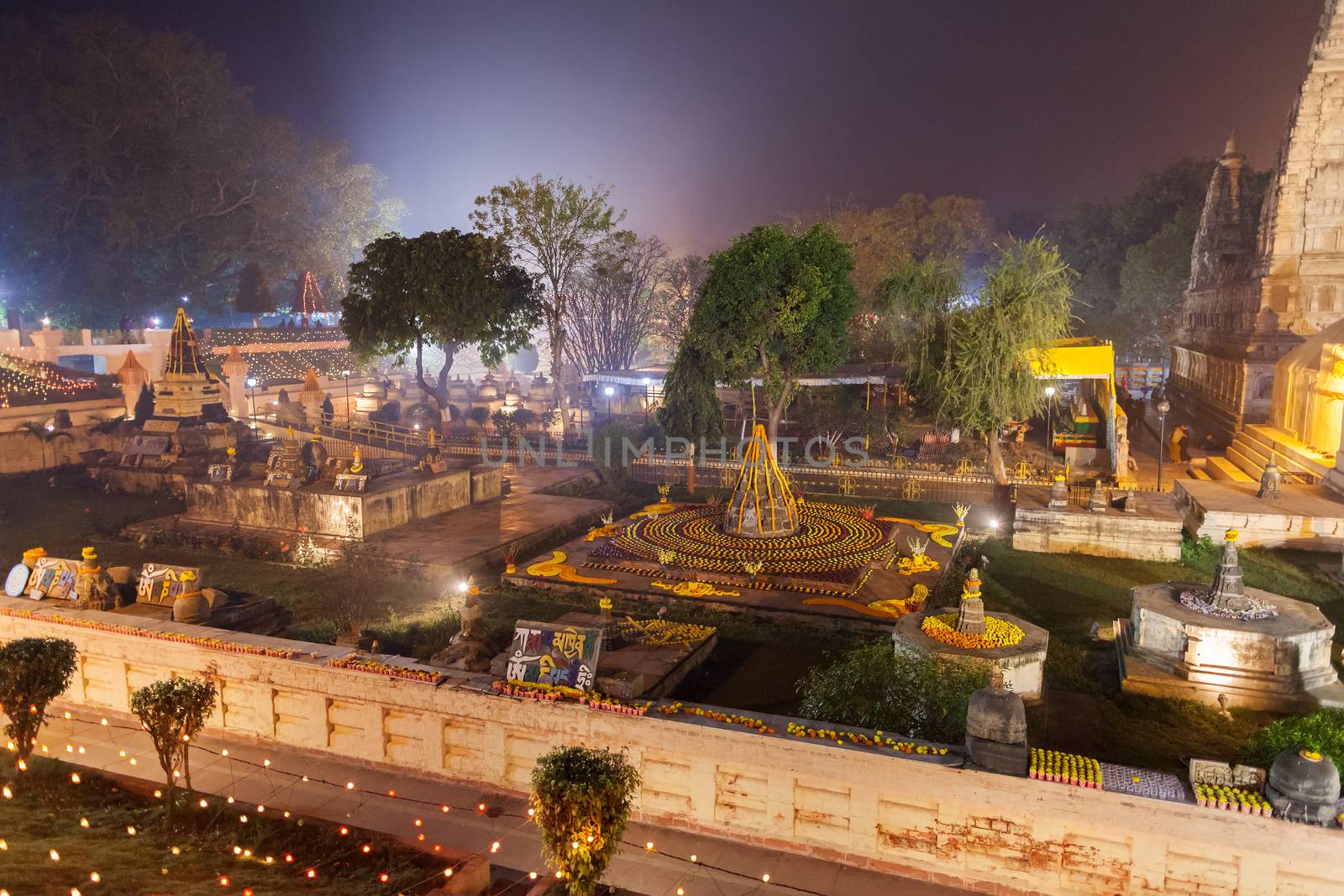 The stupas near Mahabodhi Temple decorated to celebration of Buddhist new year. by dymov