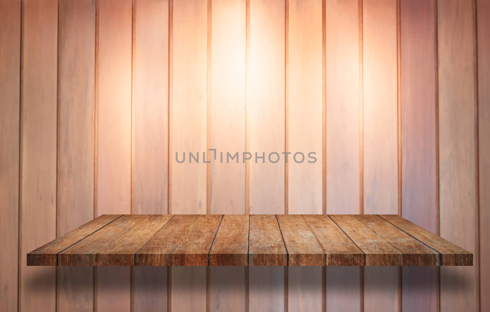 Top of wooden shelf with spot light on wooden wall background by punsayaporn