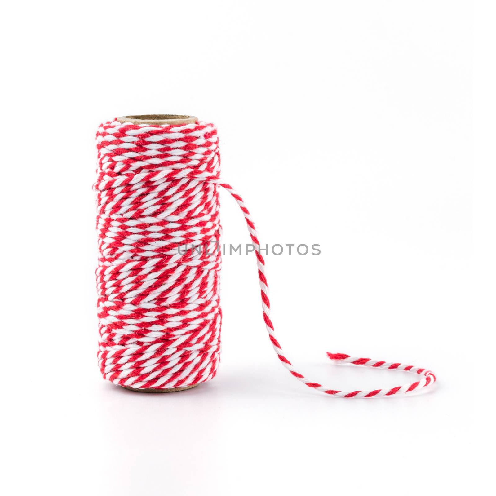 Red and white rope isolated on white background, tied tie multipurpose items seized or sticky material.