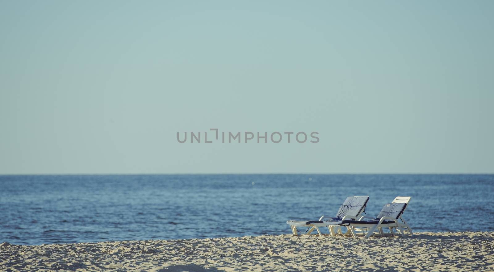 Beach lounger on the beach. Summer time