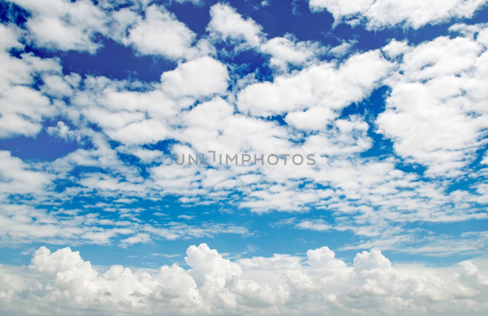 white clouds on a blue sky background