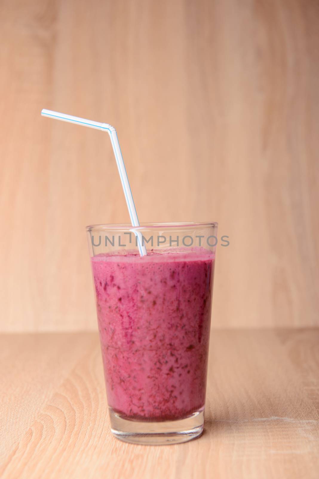 Blueberry smoothie with fresh berries, chia seeds and banana for breakfast on rustic wooden background, selective focus