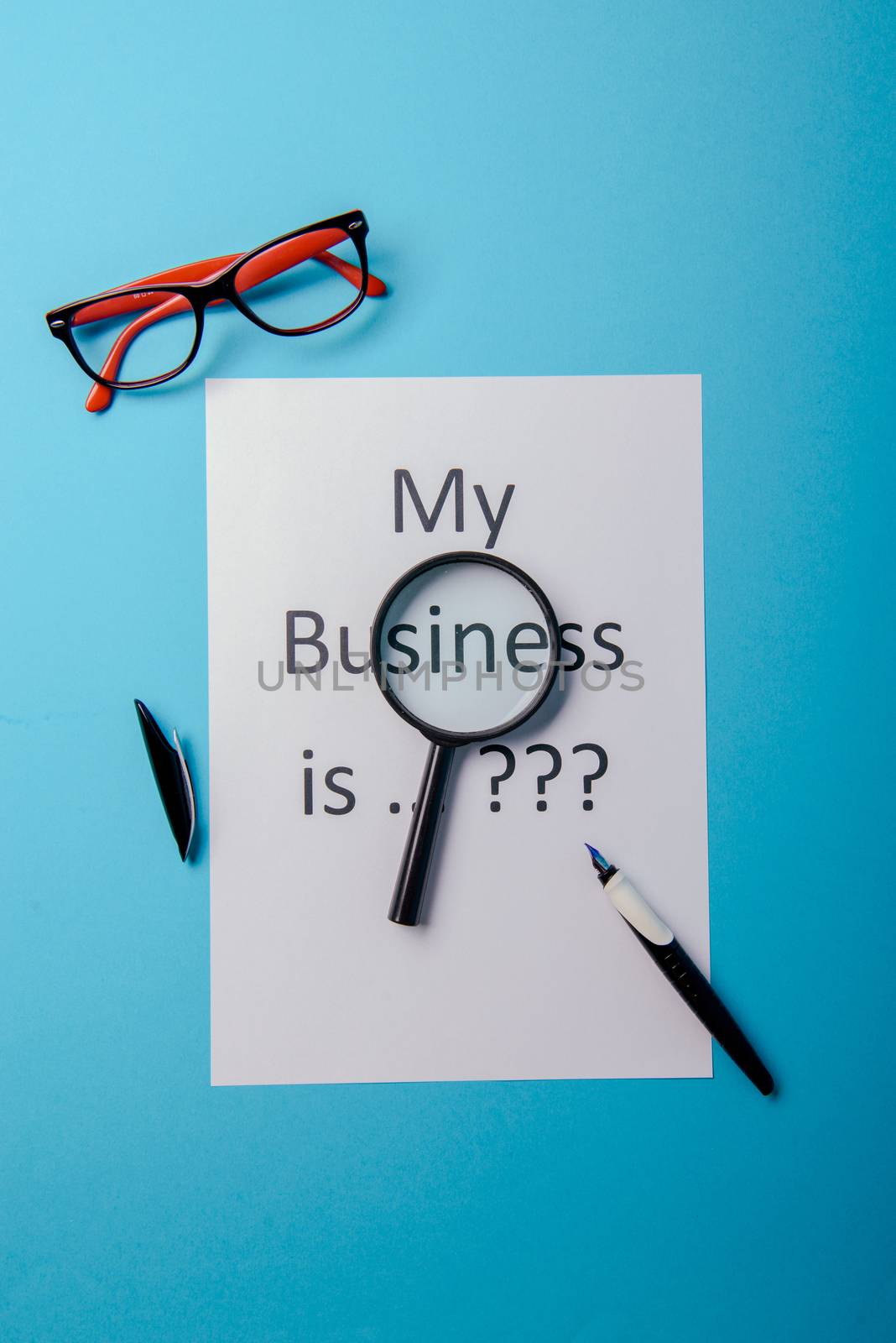 My business is word concept. Business word with business document paper on blue background. For business concept ideas background.