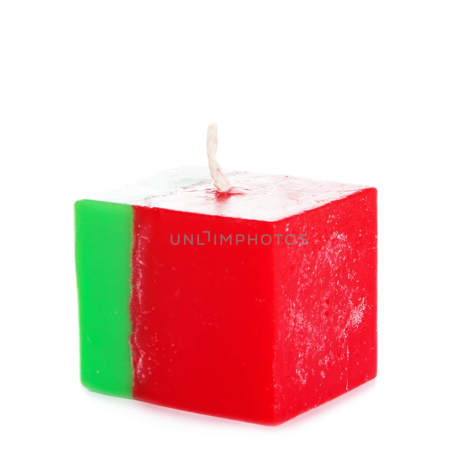 Decorative Handmade candle isolated on white background. Cube-shaped souvenir candle as Portuguese state flag and country symbol. Rectangular cube block shaped candles.