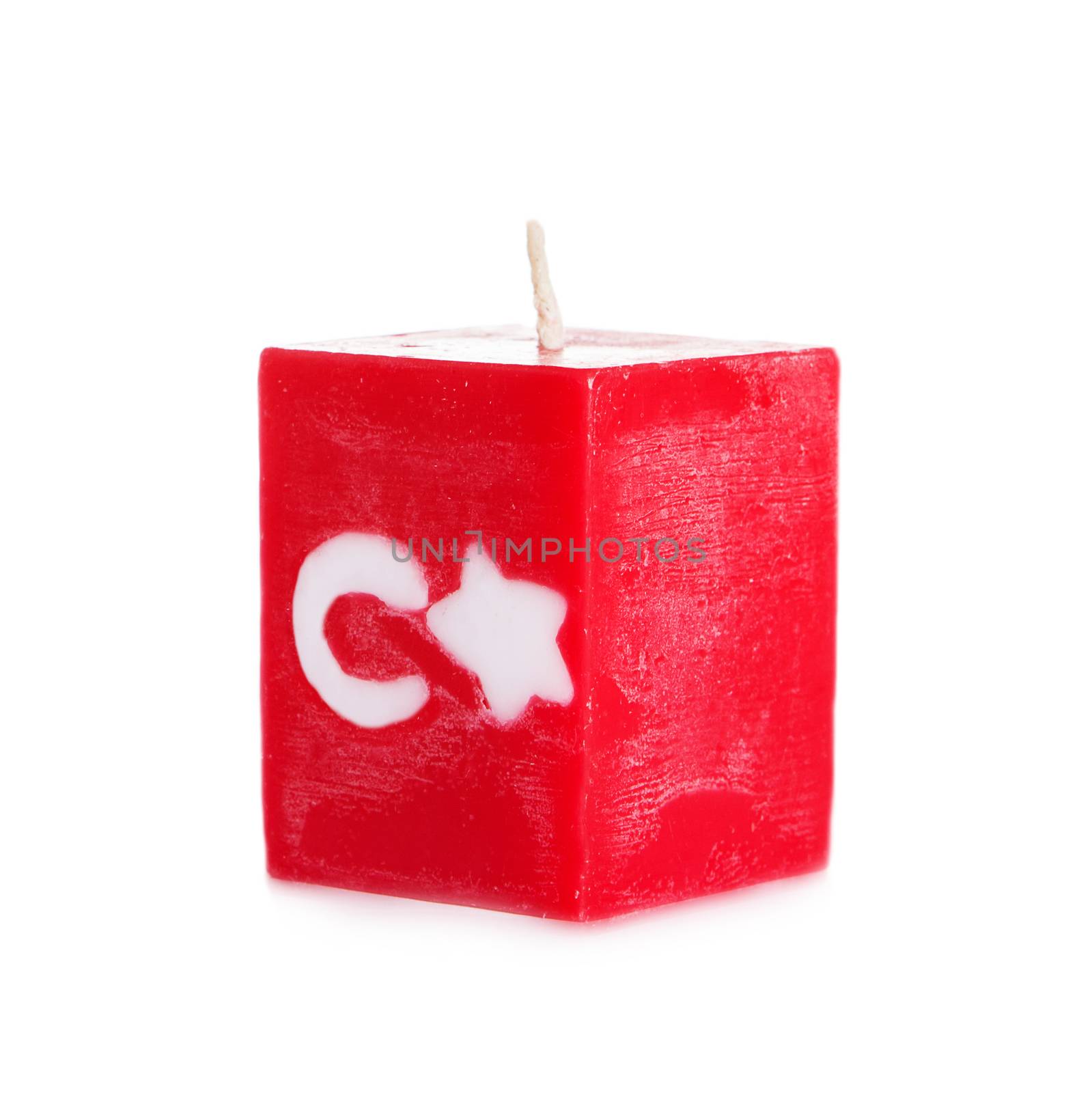 Decorative Handmade candle isolated on white background. Cube-shaped souvenir candle as Turkish state flag and country symbol. Rectangular cube block shaped candles.