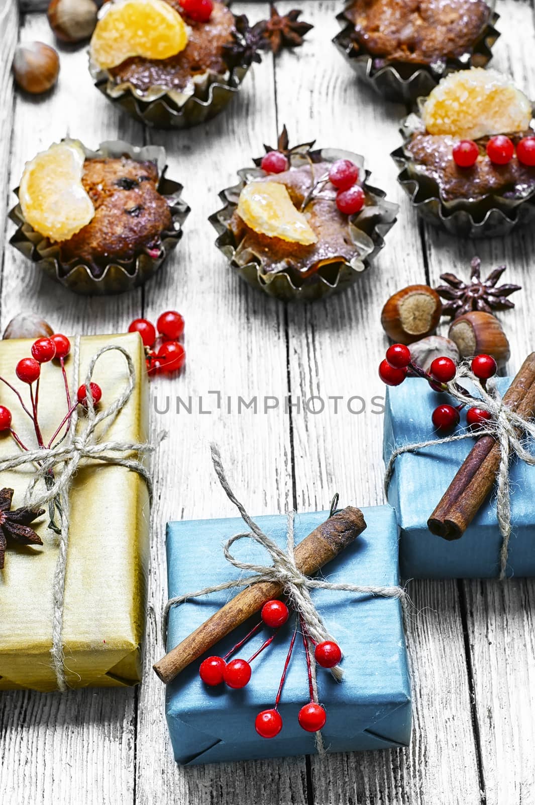 Homemade Christmas cupcakes decorated with cranberries and mandarins