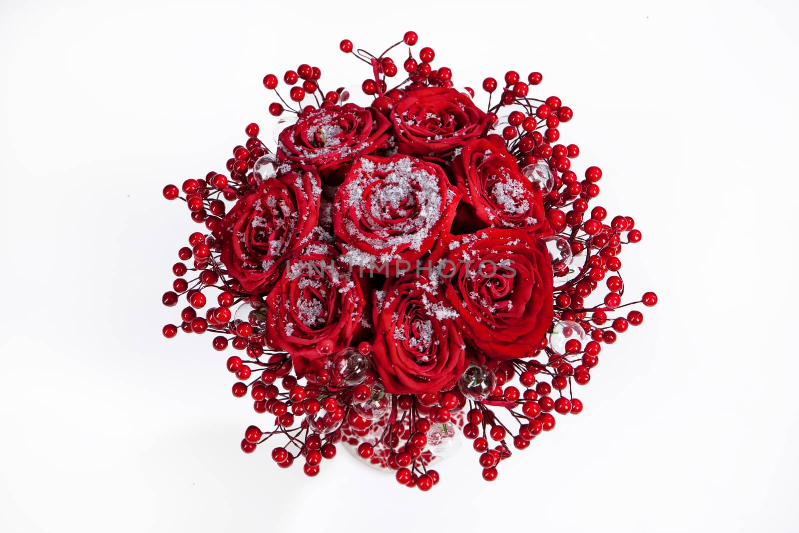 Bouquet of roses and berries on an isolated studio background