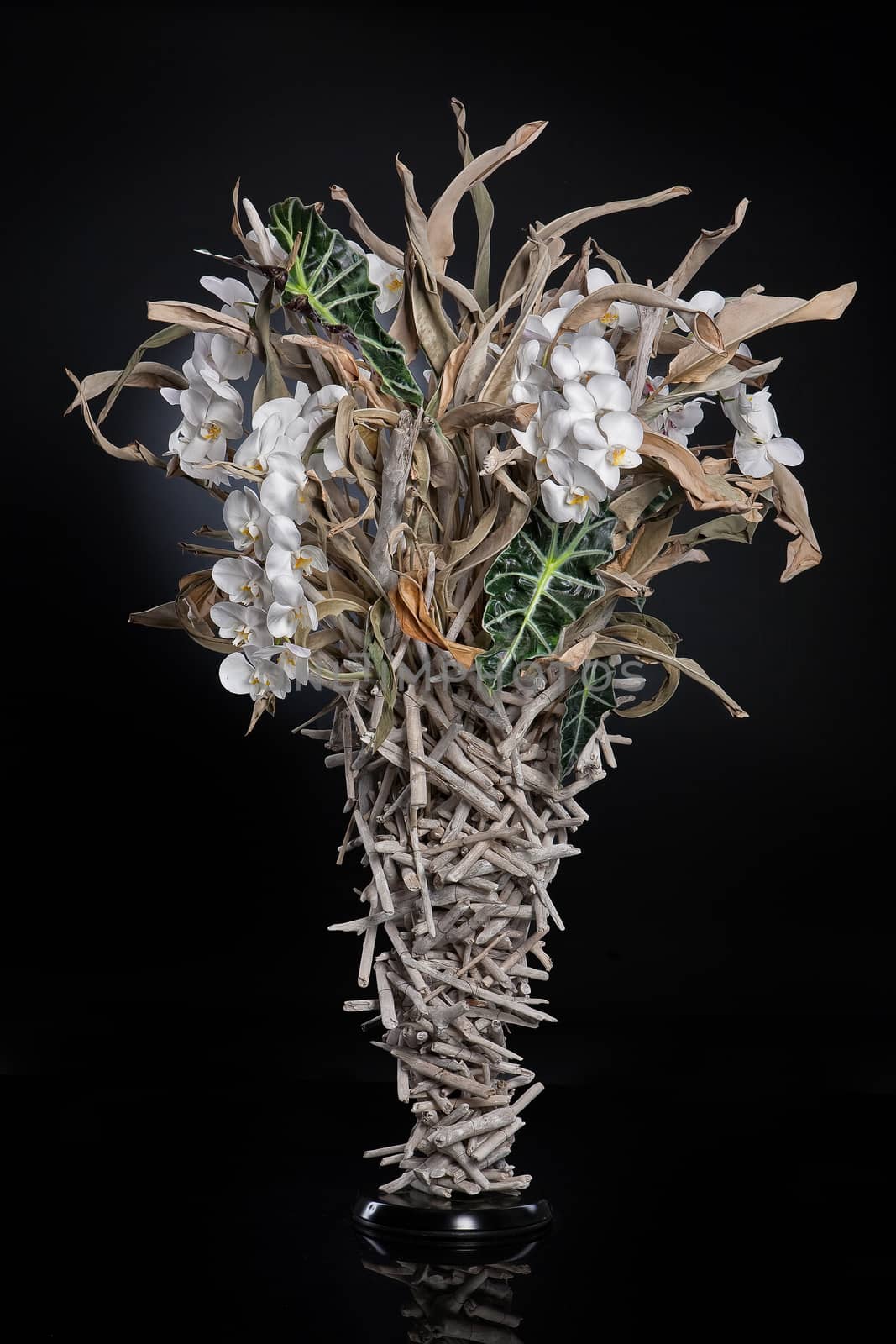 Floristic art composition made of flowers and leaves