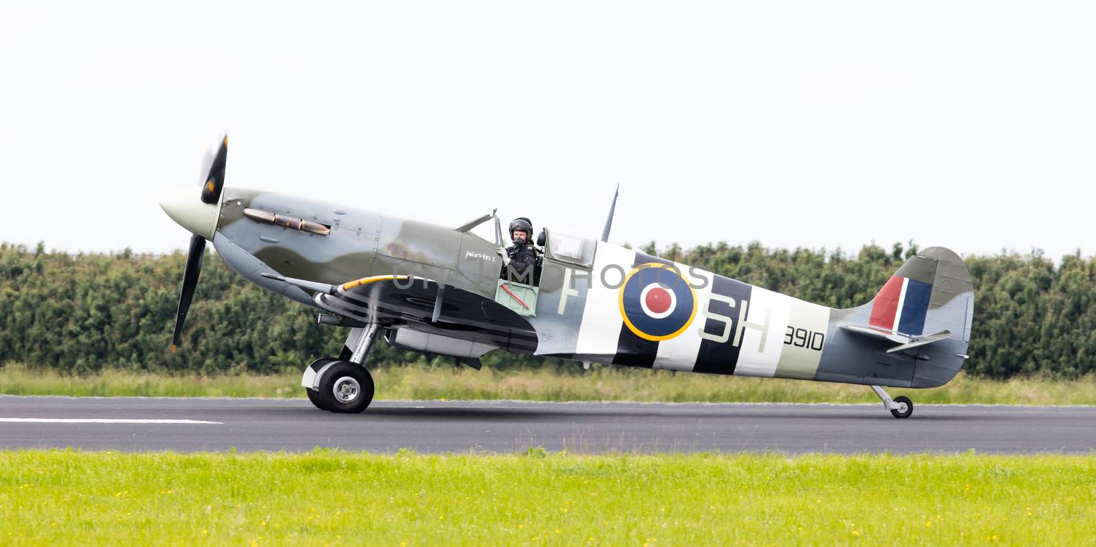 LEEUWARDEN, THE NETHERLANDS - JUNE 10, 2016: A vintage Spitfire fighter plane on the runway during a demonstration at the Royal Netherlands Air Force Days at Leeuwarden on June 10, 2016.