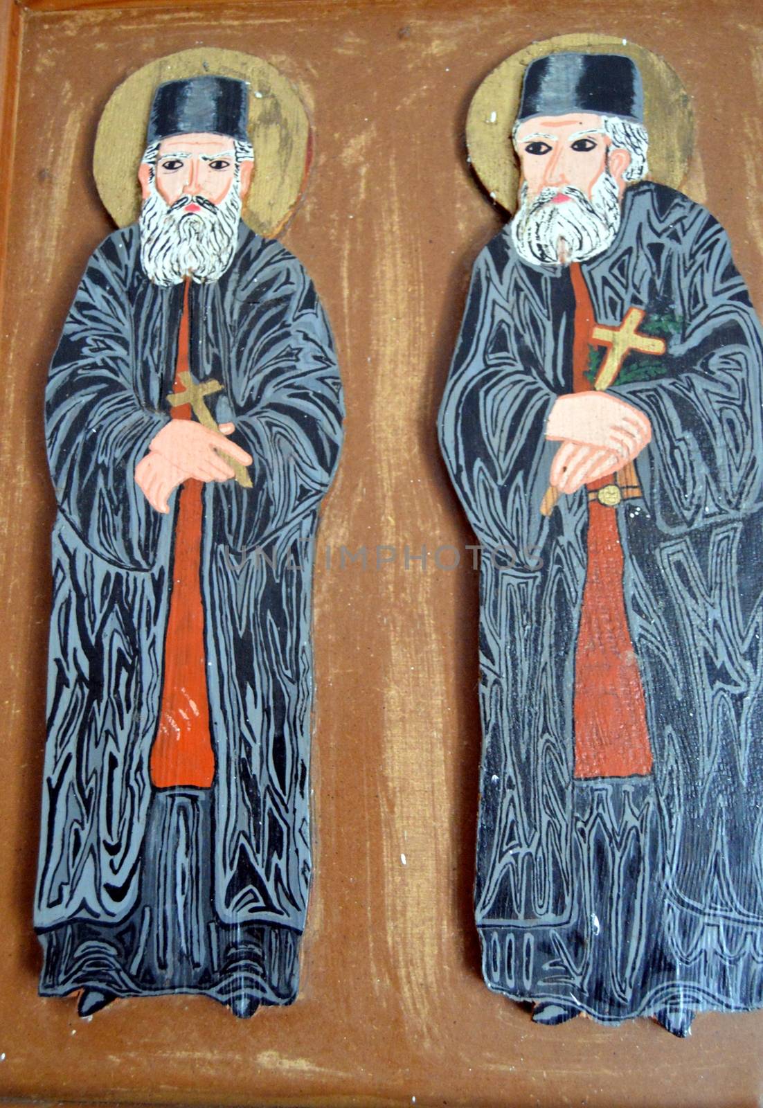Two popes Greek orthodox paints relief on a picture.