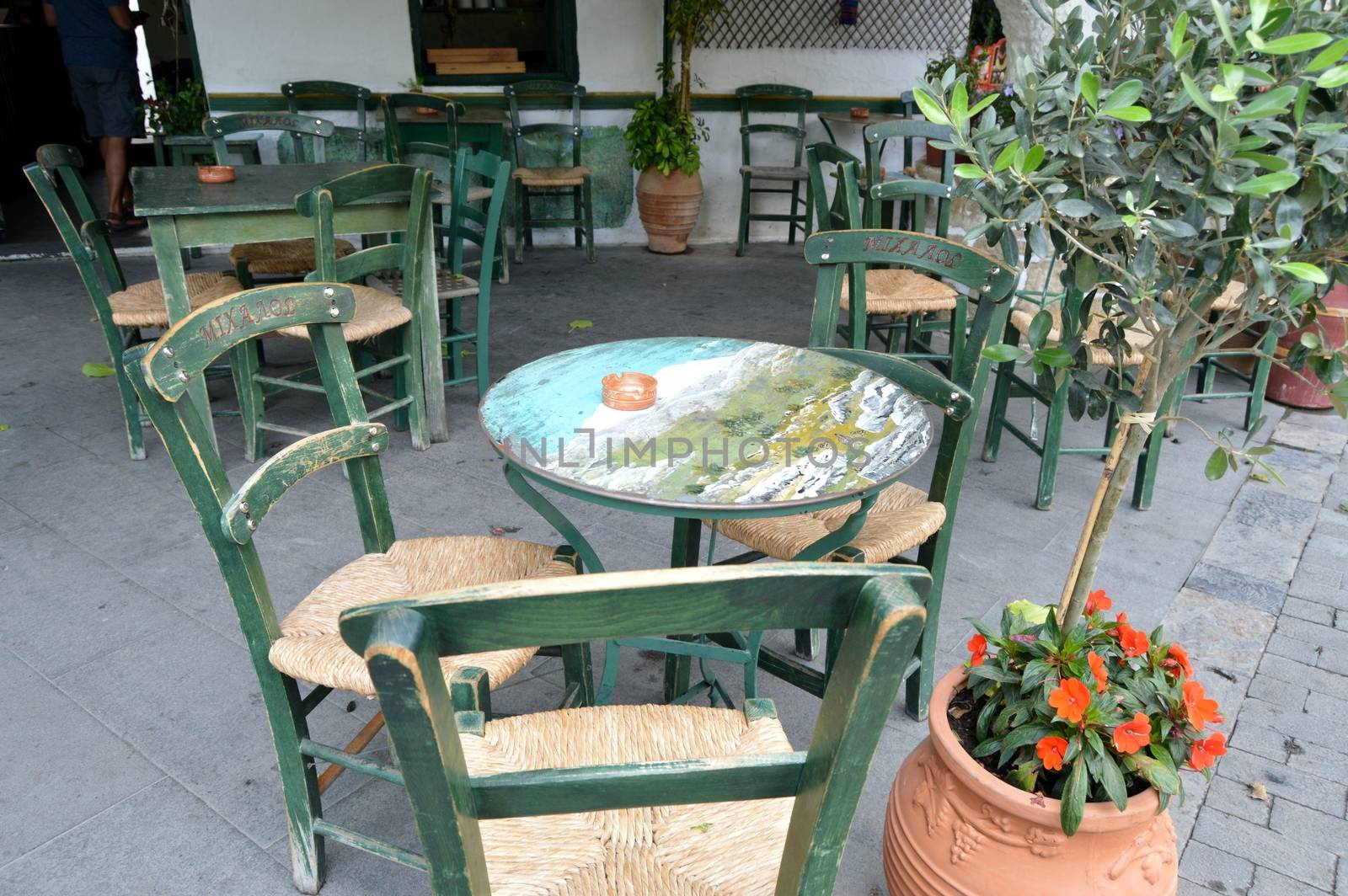 Tables of restaurant on a terrace on the island of Crete