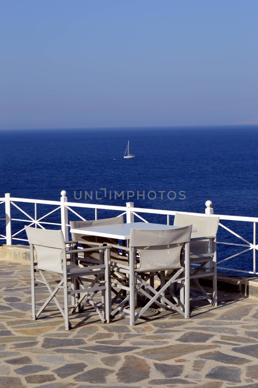 Terrace of white color on the background of ocean on the Mediterranean.