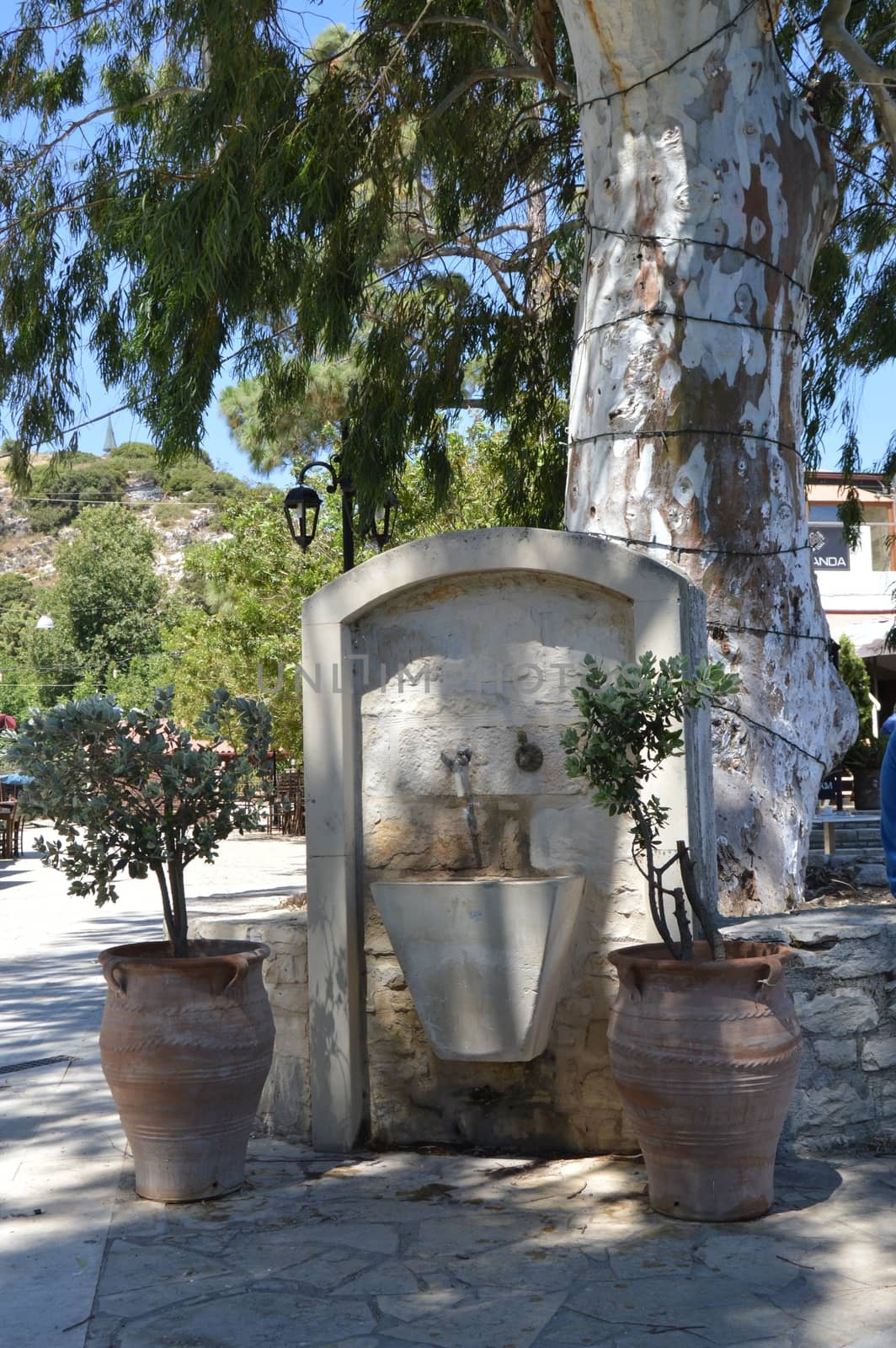 Old stone fountain in the campaign on the Cretan