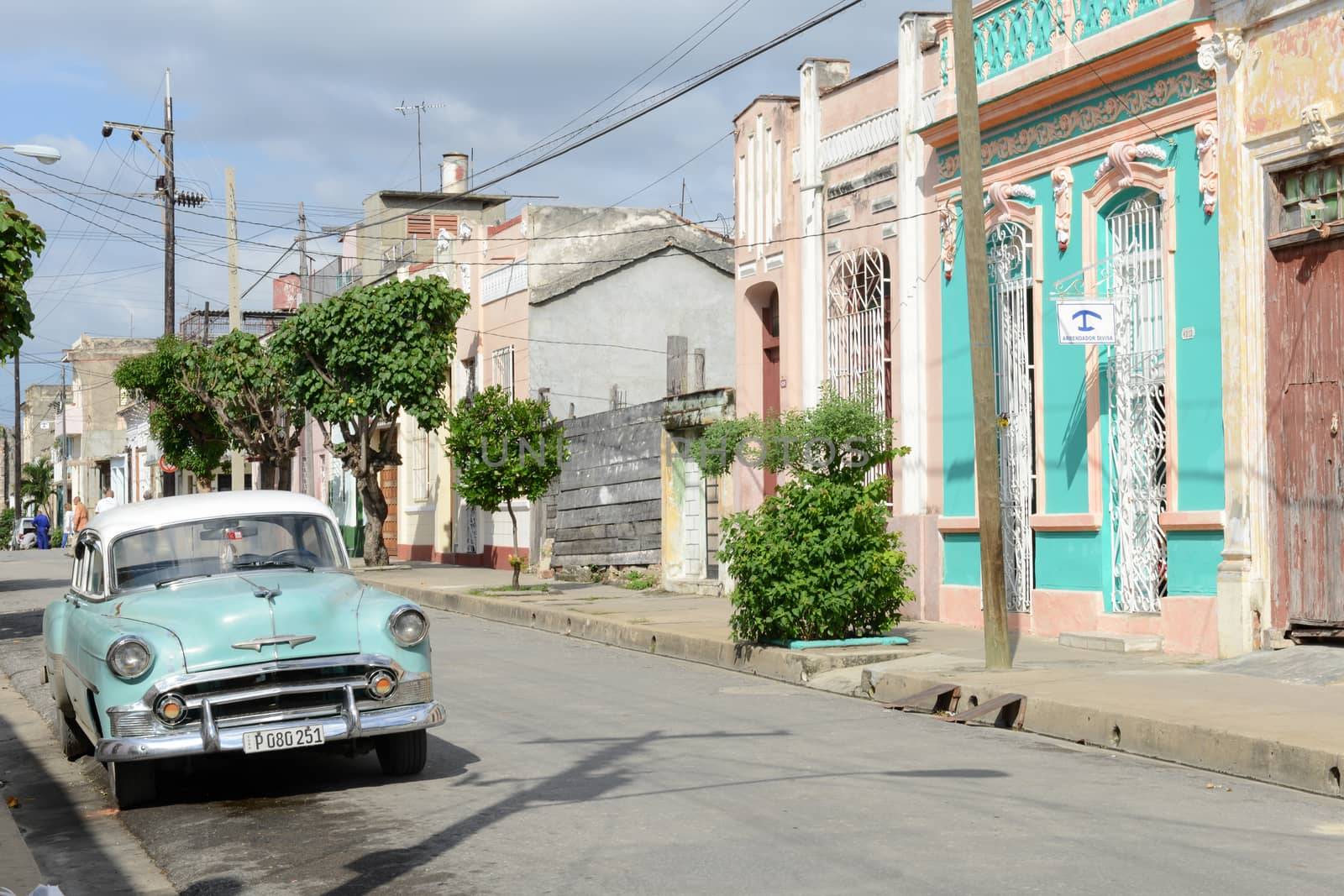 Cienfuegos, Cuba - 18 january 2016: People walking in front of colonial architecture at the old town of Cienfuegos, Cuba