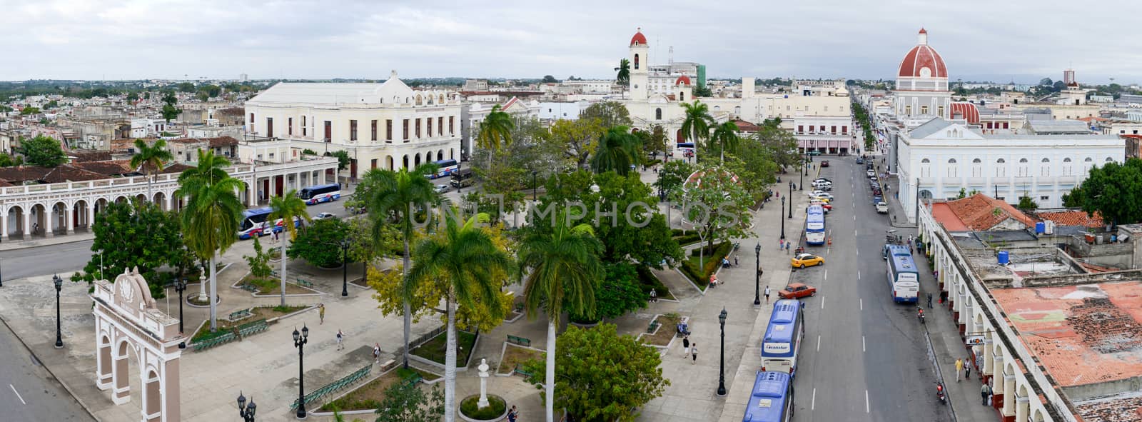 Cienfuegos, Cuba - 18 january 2016: people walking on Jose Marti park with Town Hall and Cathedral of Cienfuegos on Cuba