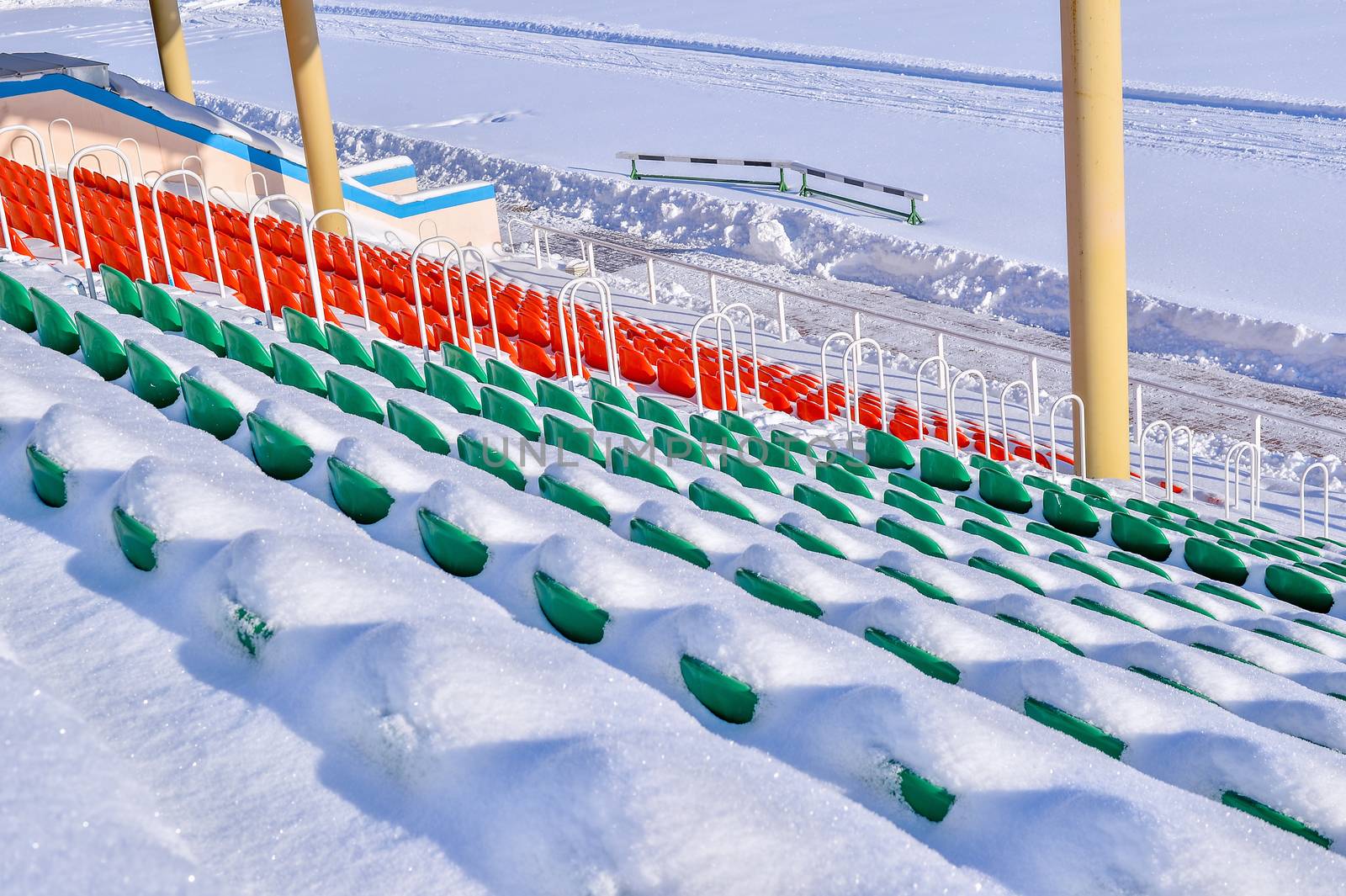 Background chairs at stadium , winter
