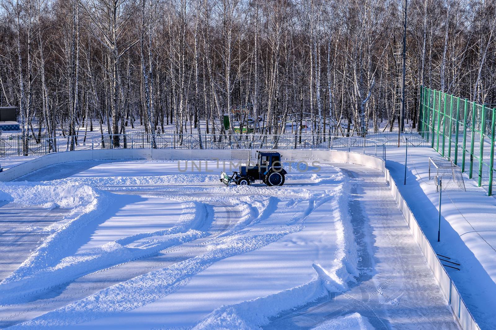 Removing snow from the pitch