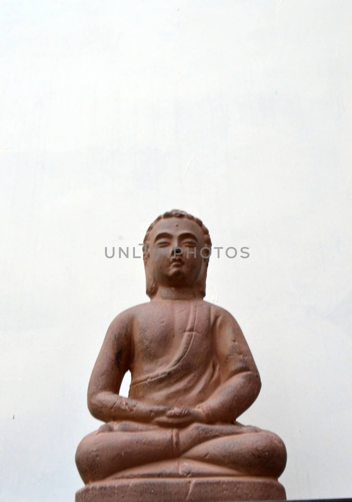 Buddha sitting on a cabinet  by Philou1000