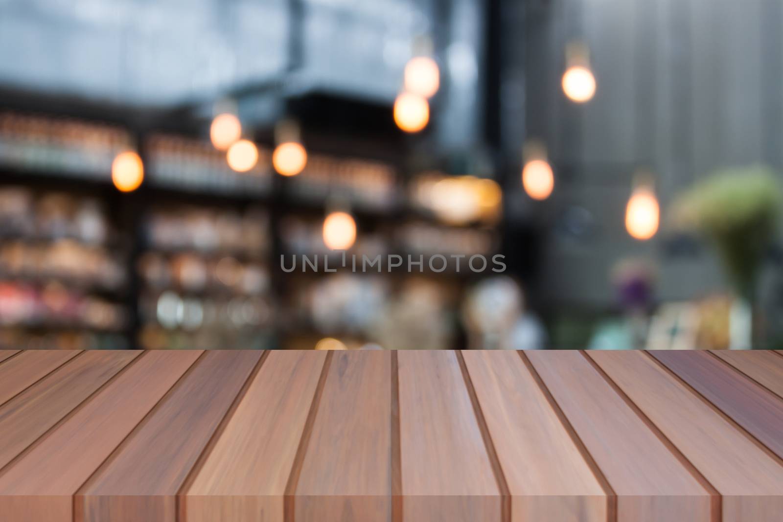 Perspective luxury top wooden with blurred cafe background by punsayaporn