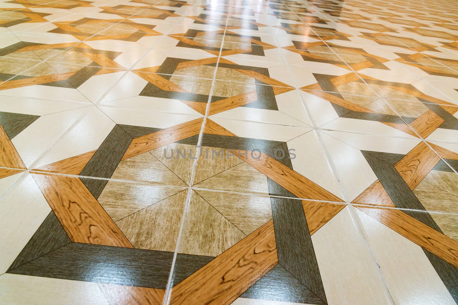 Floor tiled with patterns like parquet by olgavolodina