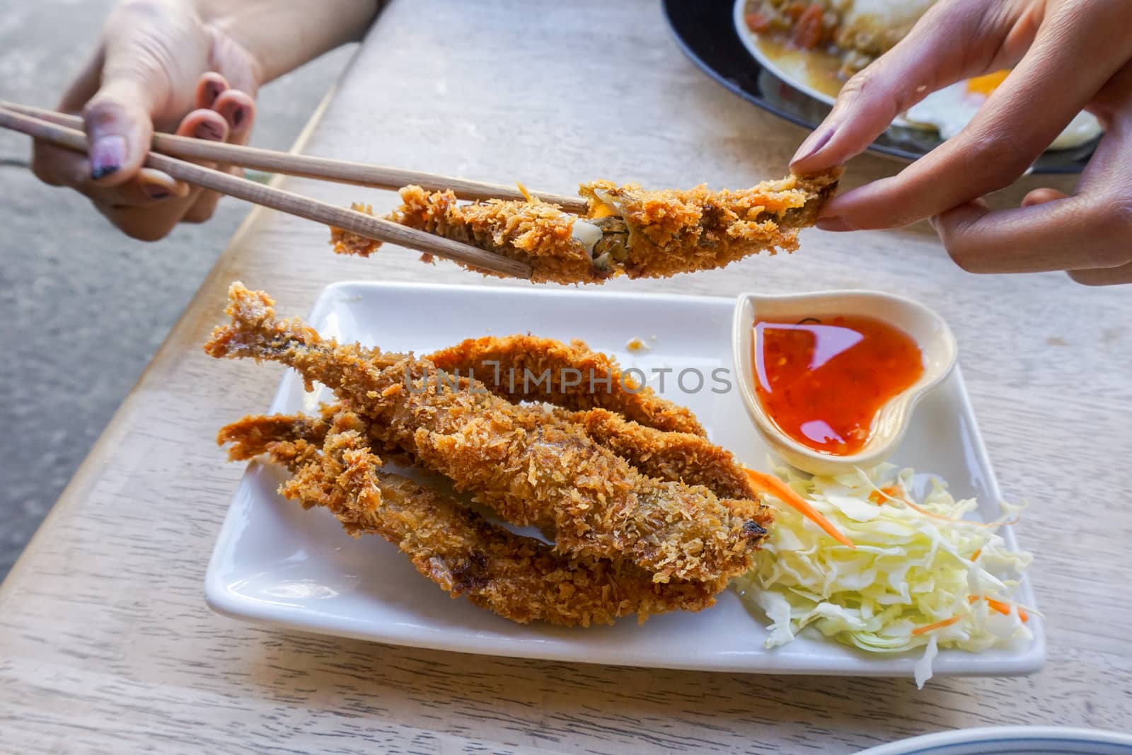 Fish fritter fried with spicy sauce by nopparats