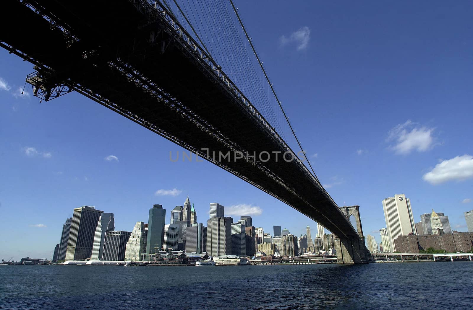 Low angle view of Brooklyn Bridge over East River