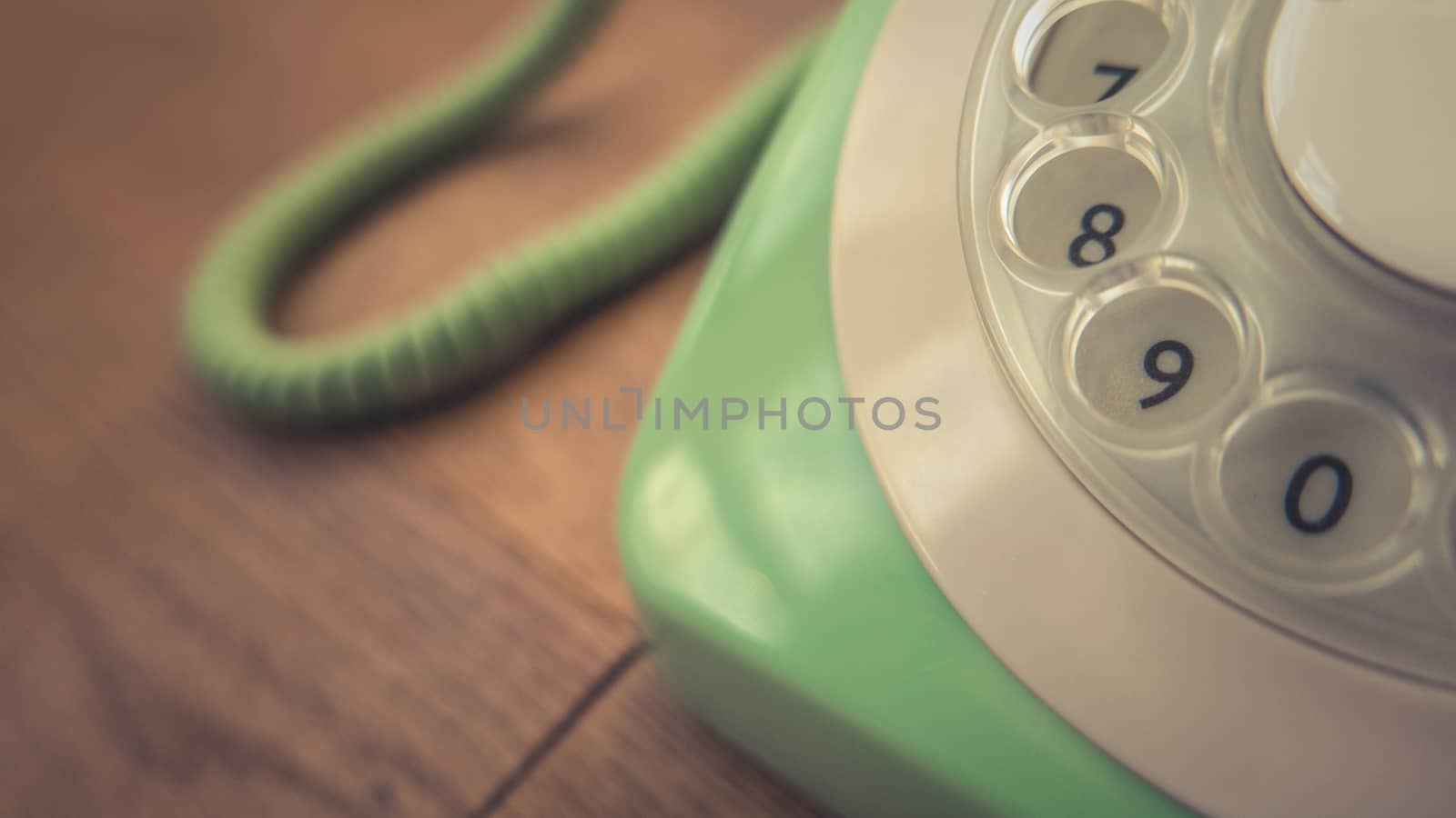 Detail Of A Pastel Green Vintage Rotary Telephone On A Rustic Wooden Table With Copy Space