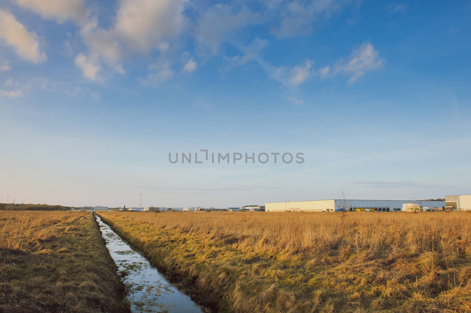 Modern industrial exterior building over blue sky
