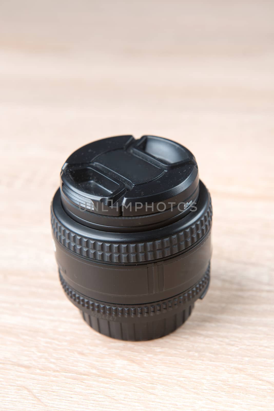 close up of a camera photo lens on white
