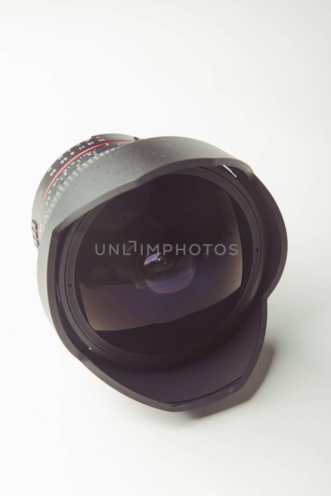 close up of a camera photo lens on white